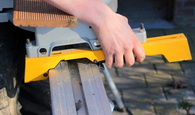 chop saw, attach to the rail, handle, rail of the chop saw, snap into place, wooden board
